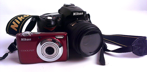 This is an example of a point and shoot camera (the red one) and a DSLR.